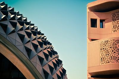 Low angle view of buildings against clear sky