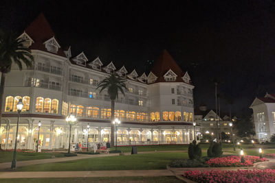 Illuminated building against sky at night