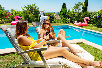 Portrait of woman relaxing in swimming pool