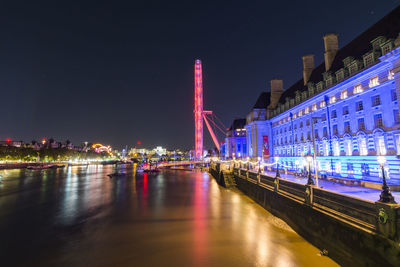 Illuminated city buildings at night