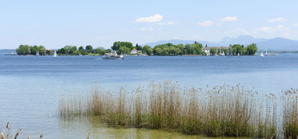 Distant view of ship sailing on river