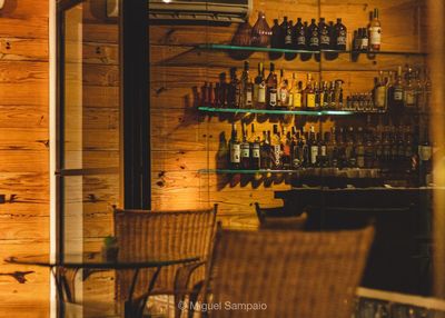 Bottles on shelf in restaurant