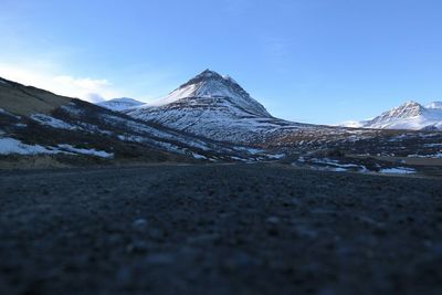 Scenic view of snow covered mountains against sky