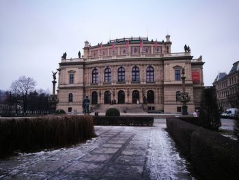 View of buildings in city against clear sky