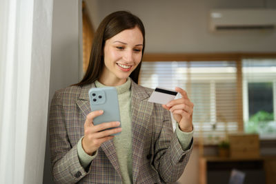 Young woman using mobile phone