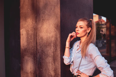 Portrait of beautiful young woman looking away