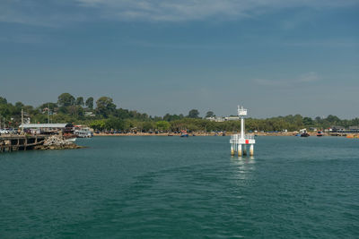 Boats in sea against sky