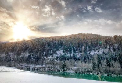 Scenic view of landscape against sky during winter