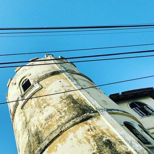 Low angle view of building against blue sky