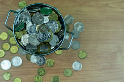 High angle view of coins on table