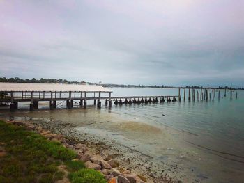 Pier over sea against sky