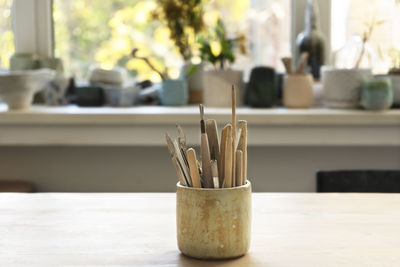 Ceramic working tools. art craft sculpting tools brush in a pottery workshop. selective focus.