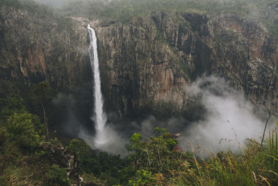 Wallaman falls 268 meter drop on a foggy day, queensland, australia.