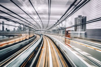 Blurred motion of light trails on bridge in city