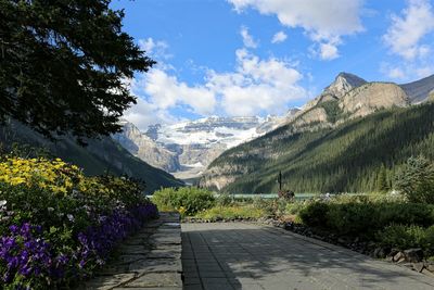 Scenic view of mountains against cloudy sky