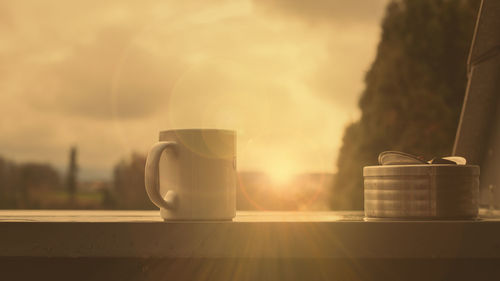 Close-up of food against sky at sunset