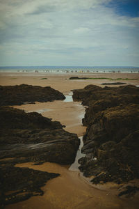 Scenic view of beach against sky