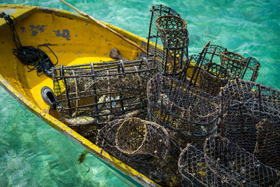 Rusty fish traps on the boat with the crystal clear water in the background in semporna, sabah.