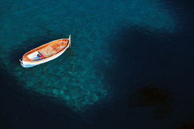 High angle view of boats moored in sea