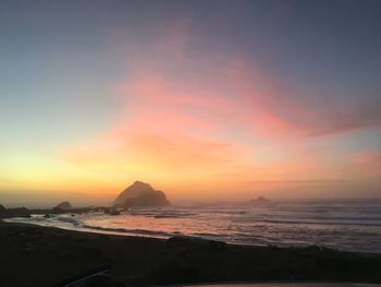 Scenic view of sea against sky during sunset