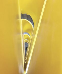 High angle view of yellow spiral staircase