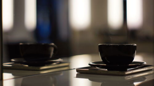 Close-up of coffee cup on table