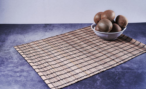 High angle view of bread on table against white background