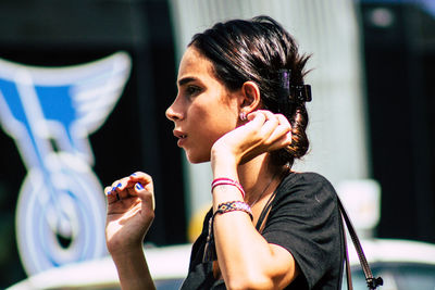 Portrait of young woman looking away