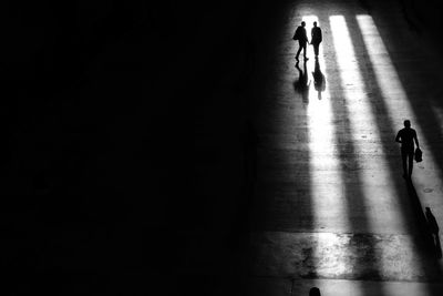 High angle view of people walking on floor