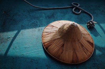 High angle view of hat and rope