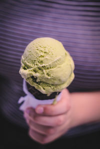 Cropped image of hand holding ice cream cone