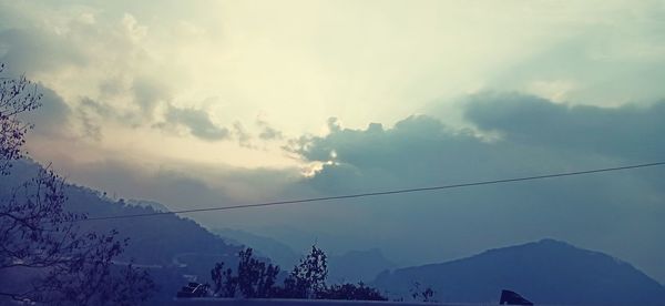 Low angle view of silhouette mountain against sky