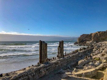 Scenic view of sea against blue sky