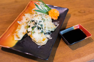 High angle view of food on table by japanese menu