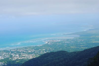 Aerial view of landscape and sea against sky