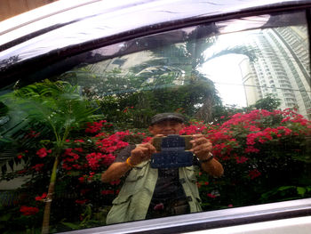 Woman looking away while standing on grass