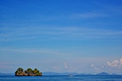 Scenic view of sea against blue sky