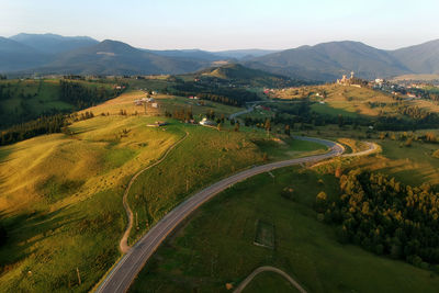 High angle view of road amidst landscape against sky