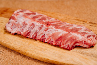 Close-up of meat on cutting board