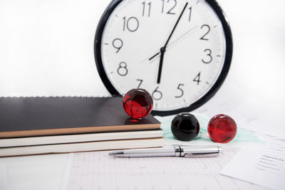 Close-up of clock on table