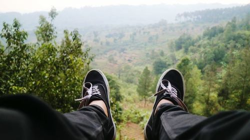 Low section of man against landscape