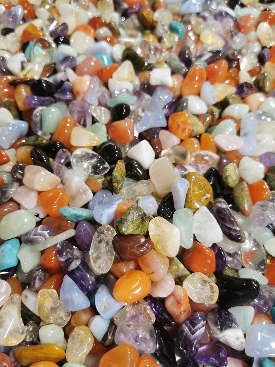large group of objects, abundance, full frame, backgrounds, multi colored, no people, gemstone, pebble, jewelry, variation, high angle view, still life, stone, semi-precious gem, close-up, fashion accessory, jewellery, precious gem, indoors, rock