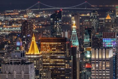 Illuminated buildings in city at night