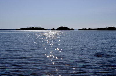 Scenic view of sea against clear blue sky