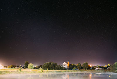 Scenic view of sea against sky at night