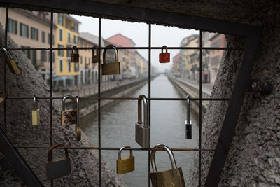 Close-up of padlocks hanging on railing