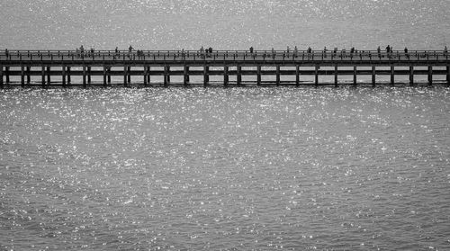 Pier over sea against clear sky