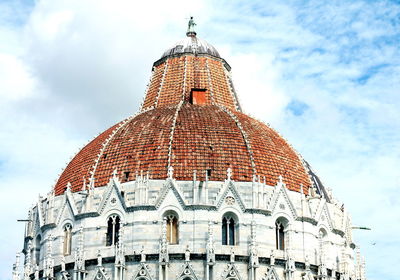 Low angle view of pisa baptistery against sky at campo dei miracoli