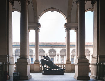 Historic building seen through colonnade