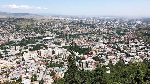 Aerial view of town against sky